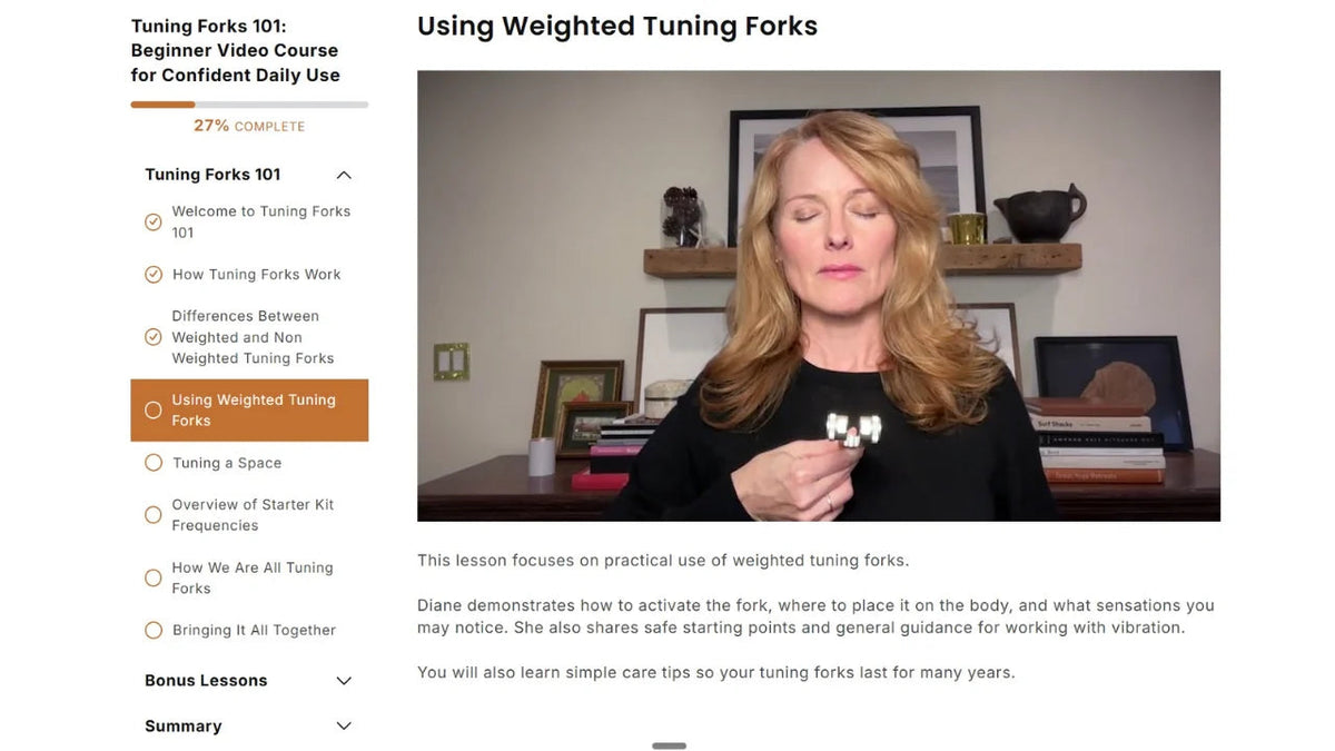 Real Tuning Forks 101 lesson screen showing Diane Hudock demonstrating a weighted tuning fork.